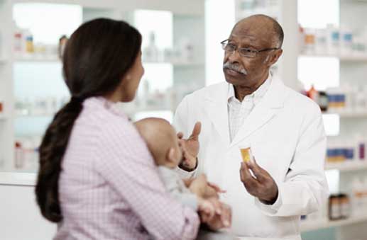 Pharmacist speaking with patient