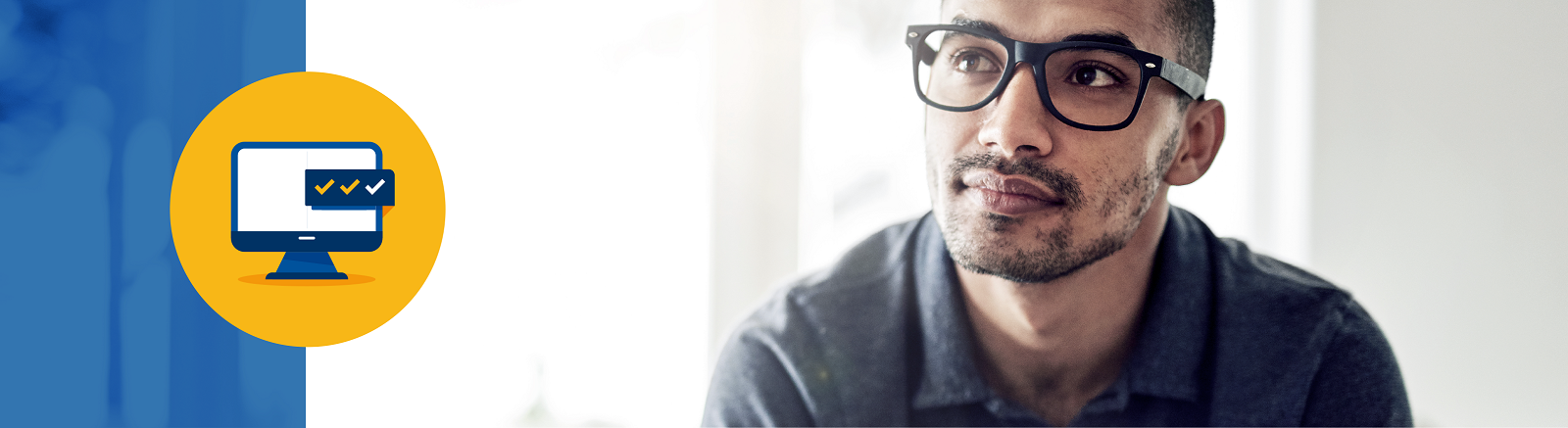 Young man with glasses gazing into the distance