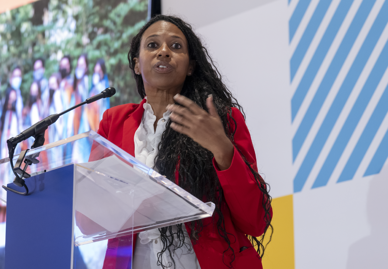 Woman speaking at a podium