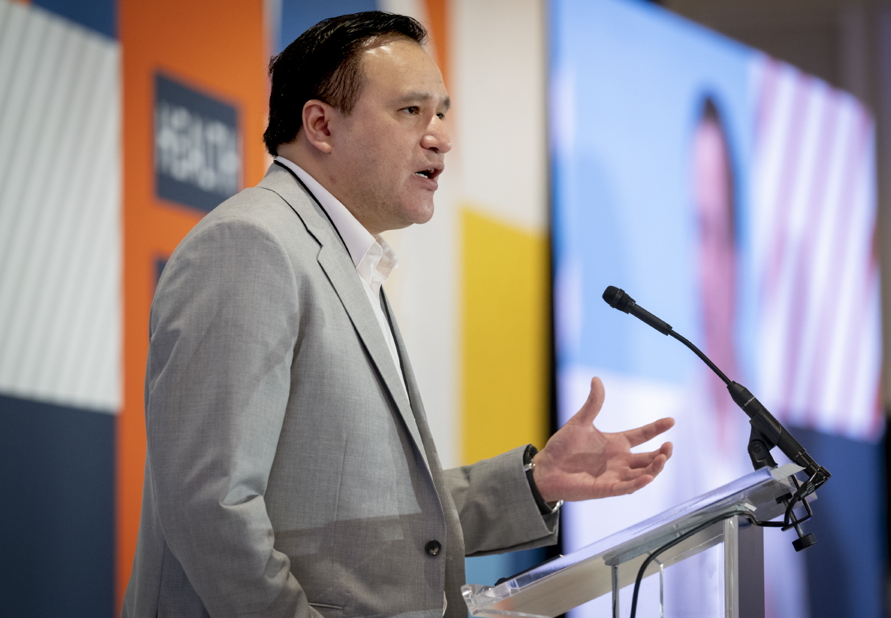 Man speaking at a podium