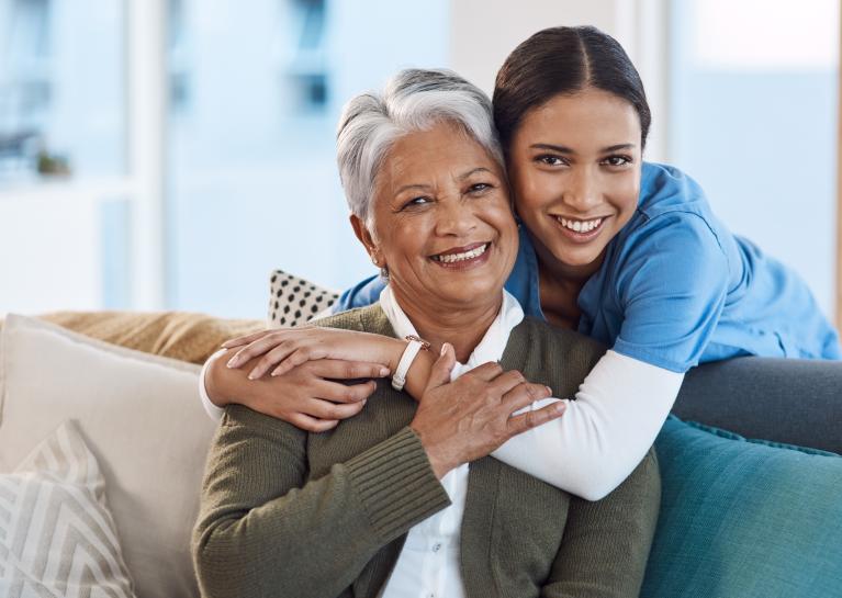 Medical professional hugging patient